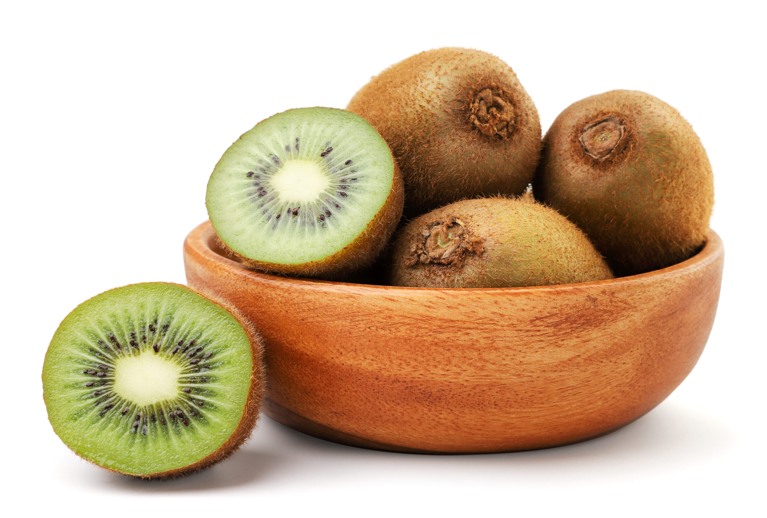 Kiwi fruit whole and half in a wooden plate close-up on a white background. Isolated